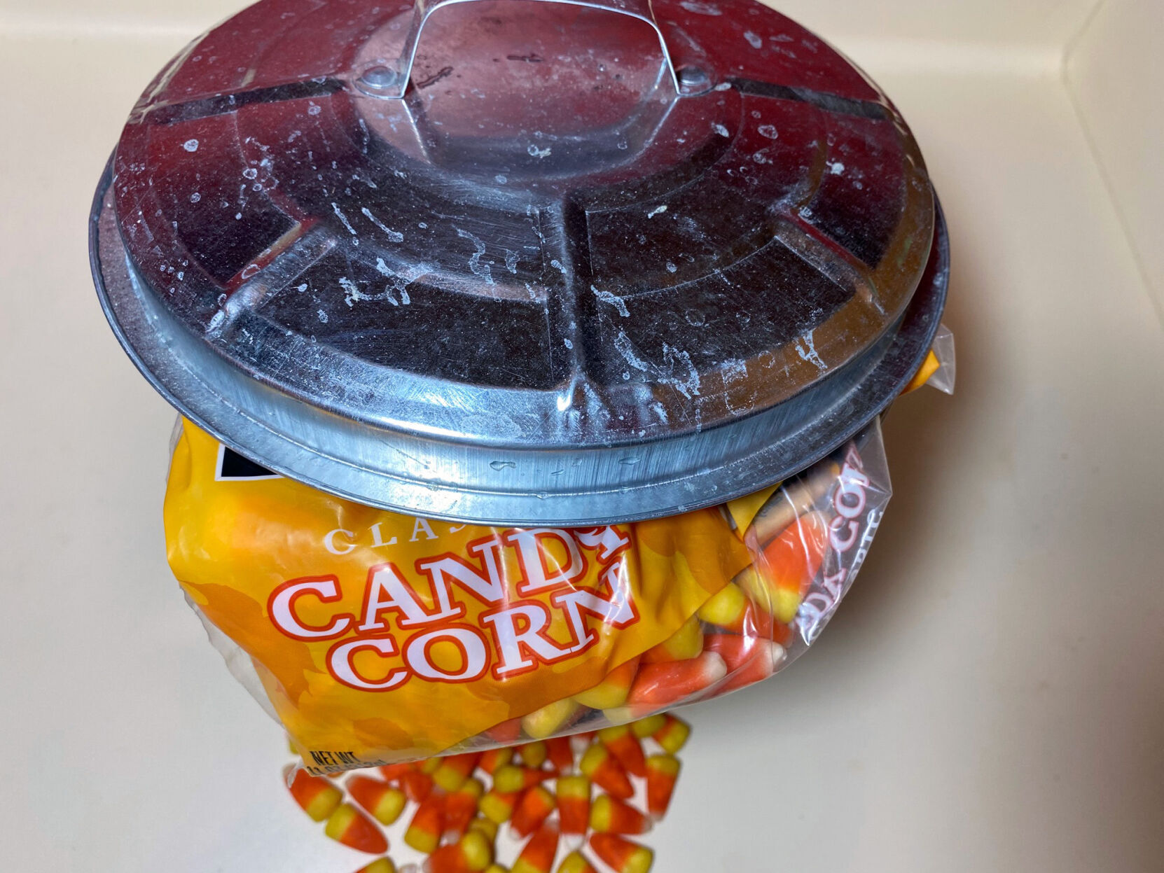 Candy corn in the garbage